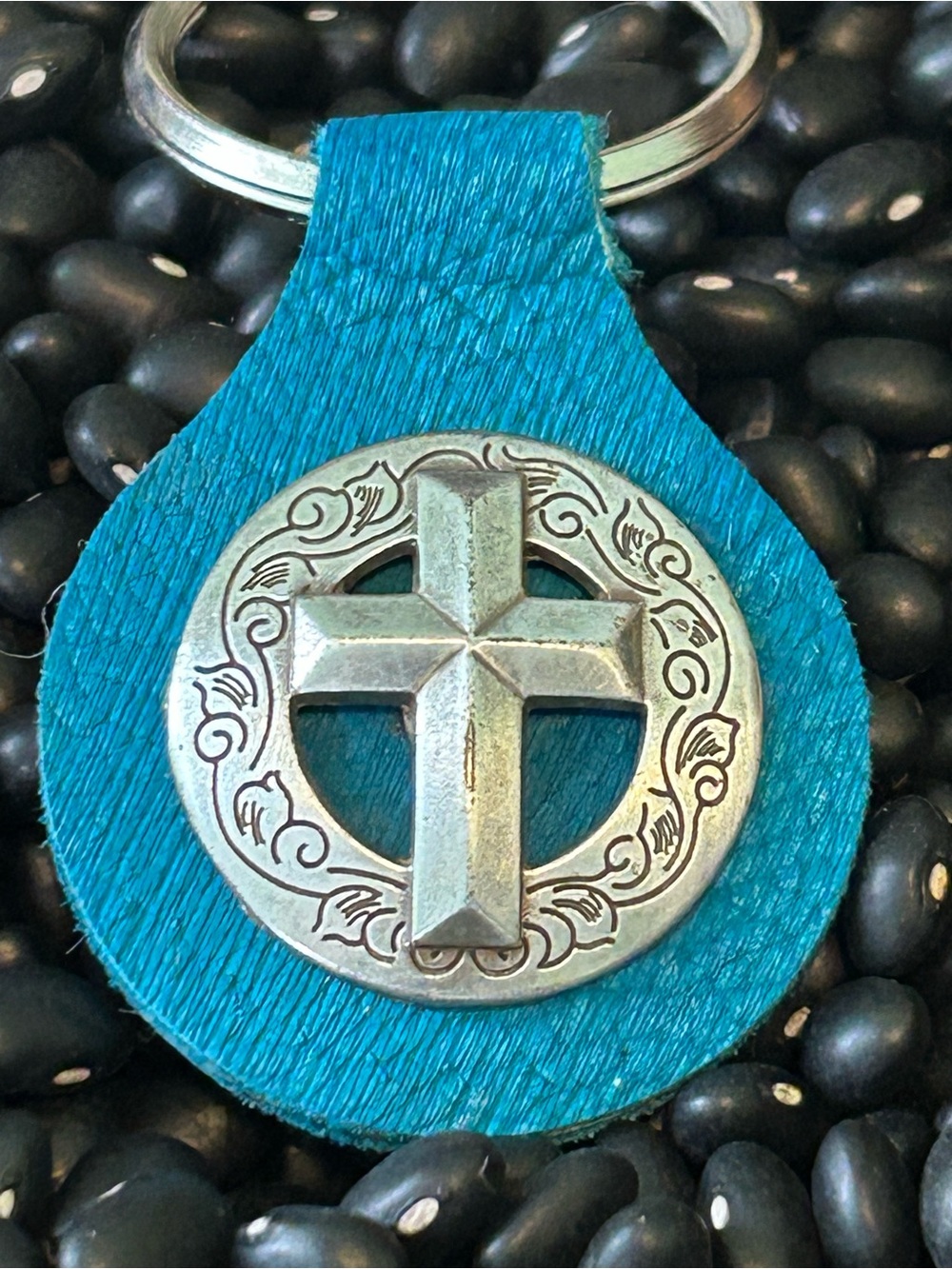 Turquoise Leatherette Keychain with Silver Cross Emblem